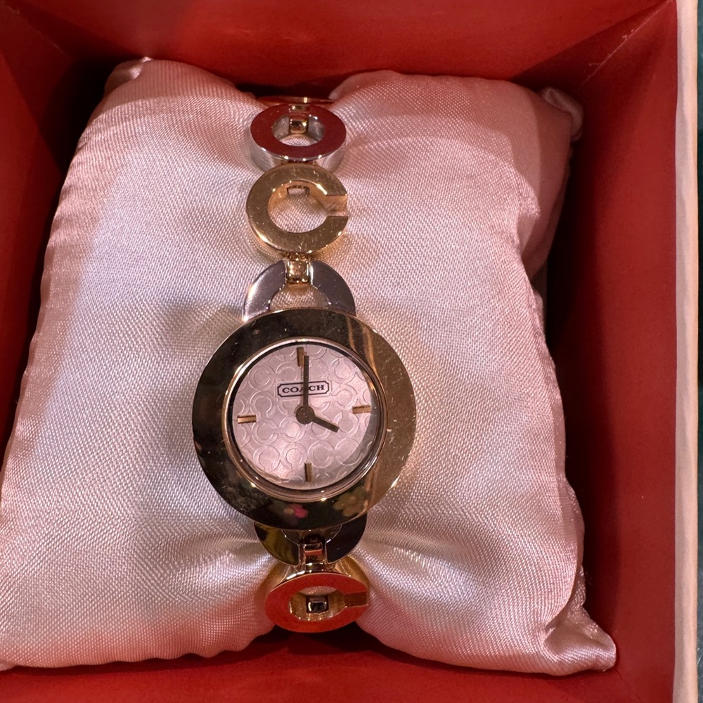 Coach Women's Two-Tone Circular Watch Signature silver and Gold tone